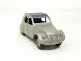 a small toy car that is sitting on a white surface