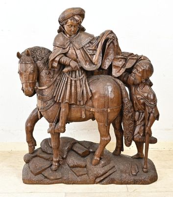 une statue représentant un homme à cheval avec un enfant