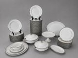 a lot of plates and bowls that are on the table