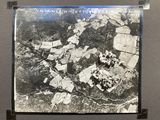 an old black and white photo of a small town in the middle of a forest