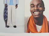 a man standing in front of a picture of himself