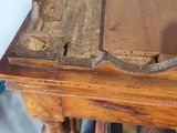 a wooden table with a piece of wood on top of it
