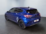 the rear end of a blue car in a showroom
