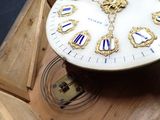 a clock that is sitting in a box on the floor