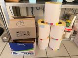 several rolls of paper are stacked on top of each other in a room