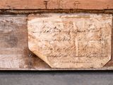 a piece of paper on a piece of wood