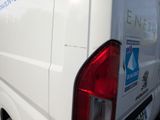 a white van that is parked on the side of the road