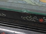 a close up of a decorative box with a painting on it