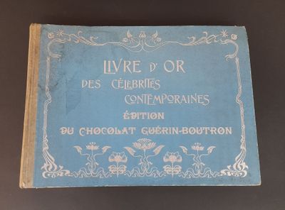 an old book sitting on top of a table next to a cup of coffee