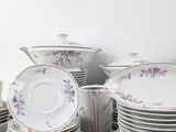 a lot of plates and bowls stacked on top of each other