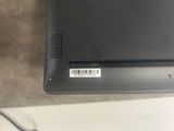 a black laptop with a bar code on it