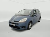 a blue citrole is parked in a white room