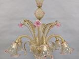 chandelier made of muranoni glass with pink flowers and gold accents