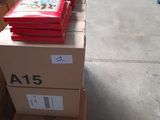 several boxes of books are stacked on top of each other in a warehouse