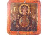 painting of the virgin mary and child jesus on a wooden plaque