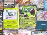 a lot of pokemon cards that are on the table