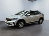 a silver volkswagen suv parked in a large room