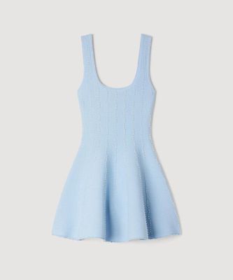 a little girl in a light blue dress