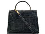 a black crocodile skin handbag with gold hardware
