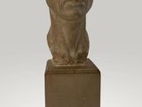 bust of a man on a pedestal with a gray background