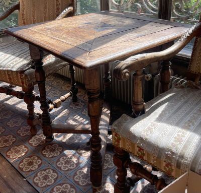an image of a dining room with a table and chairs