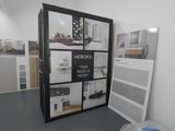 an image of a room with a lot of shelves and a refrigerator