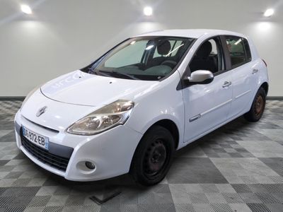 a picture of a small white car parked in a garage