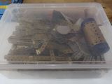a plastic container filled with assorted legos on top of a table