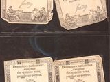 three old french currency cards are displayed in a display case
