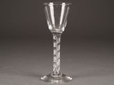 a wine glass that is sitting on a table