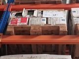 many boxes of mail sitting on a shelf in a warehouse