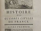 an old book with a picture of a man riding a horse
