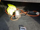 a cell phone sitting in the trunk of a car