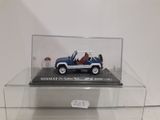 a miniature car in a clear display case on a table