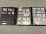 several different types of stamps are displayed on a table