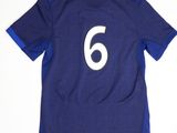 the shirt is blue and white with a number 6 on it