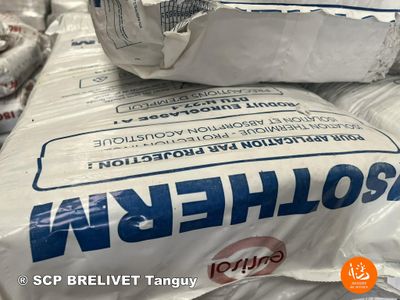 a bag of rice sitting on top of a pile of bags