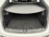 the back of a car with the trunk open and the seat folded down