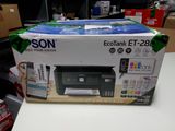 a box with a printer on it sitting on a table