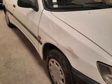 a white car that is parked in a garage