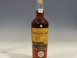 a close up of a bottle of whisky on a table