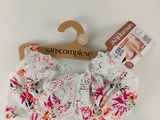 a close up of a white bra top with pink flowers on it