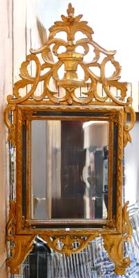 a mirror that is sitting on a table in a room