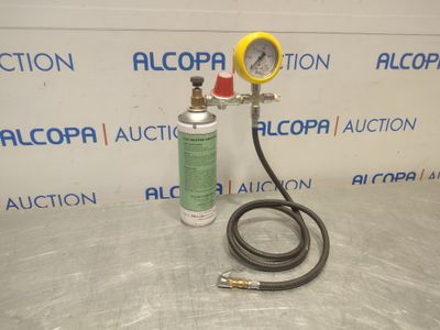 a close up of a hose and a pressurer on a table