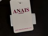 a tag that says anals on it next to an airplane
