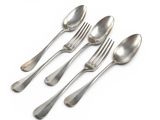 four silver spoons and two silver spoons on a white surface