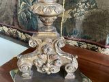 a statue of a woman on a pedestal on a table