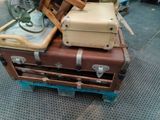 several pieces of luggage stacked on top of each other on top of each other