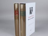 the two books are sitting in the box on the table