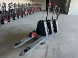 a large group of red and black forklifts in a warehouse